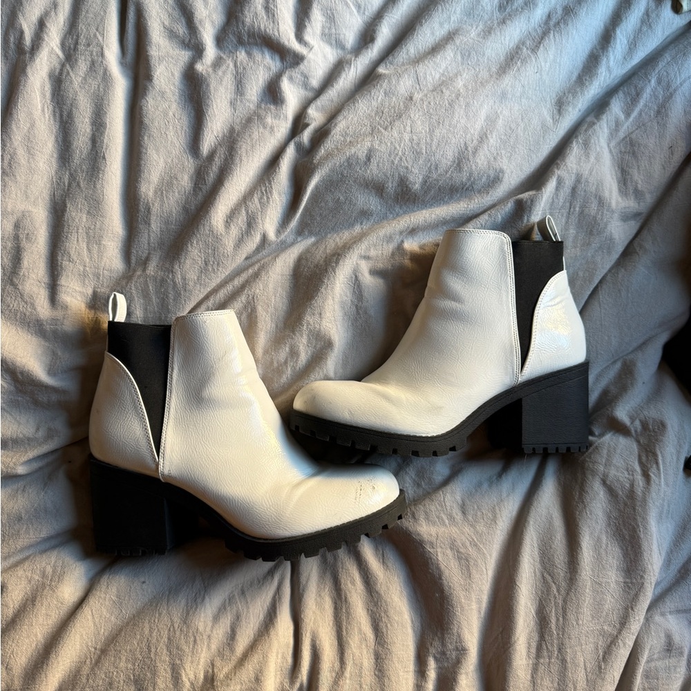 White ankle boots with black accents. Only flaw is on slide 3, little scuff mark